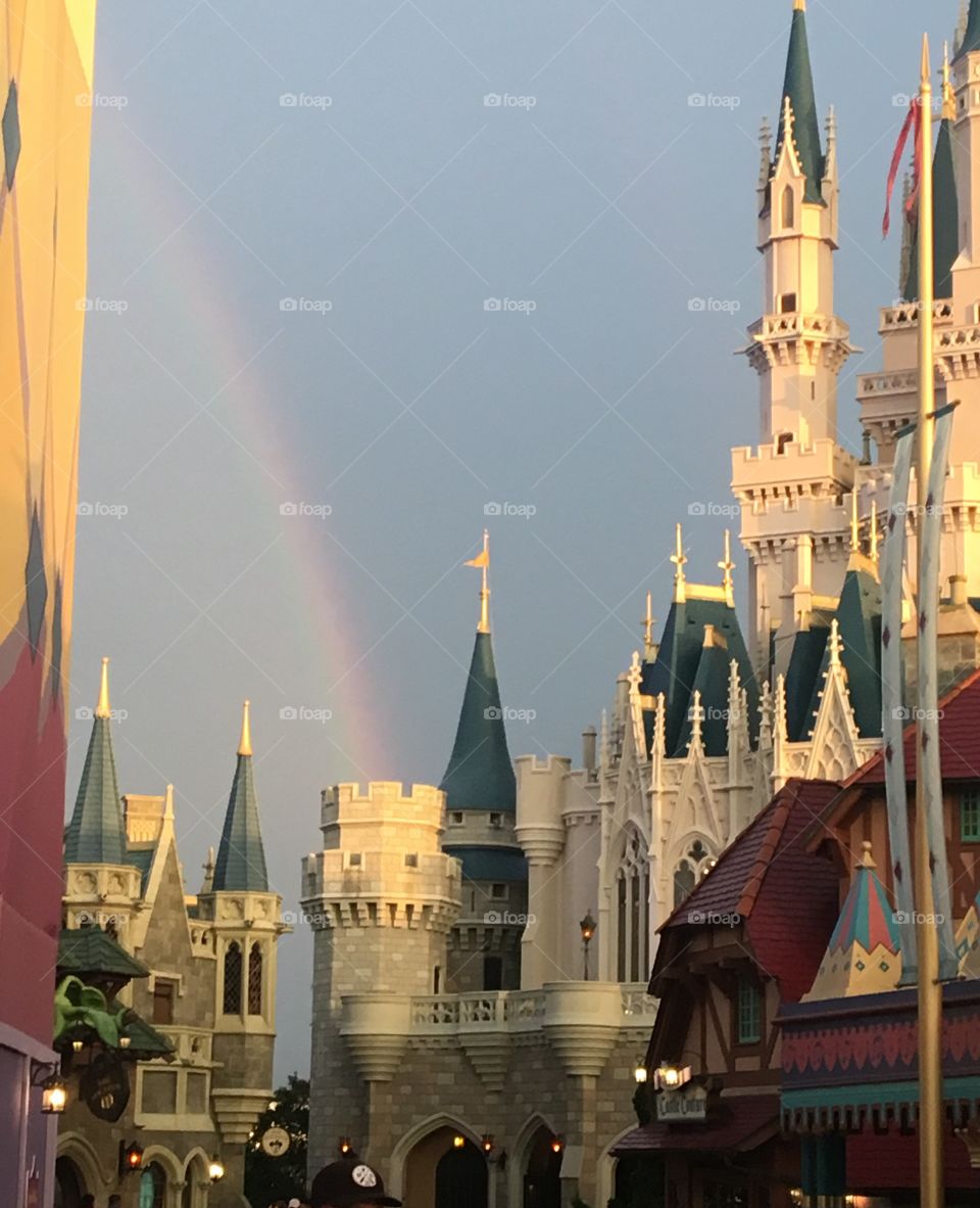 Rainbow over castle in the happiest place on earth