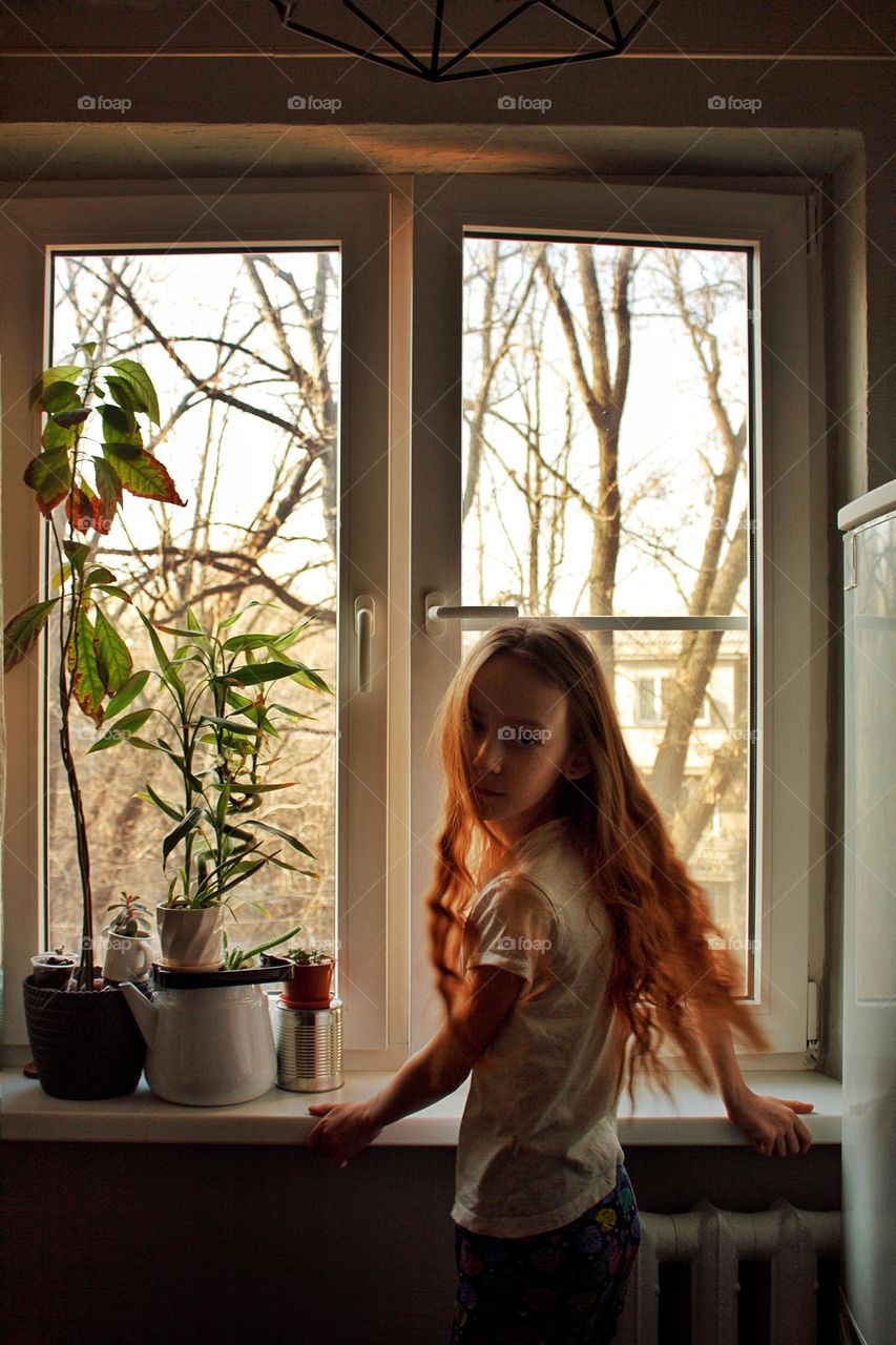 Girl near the window