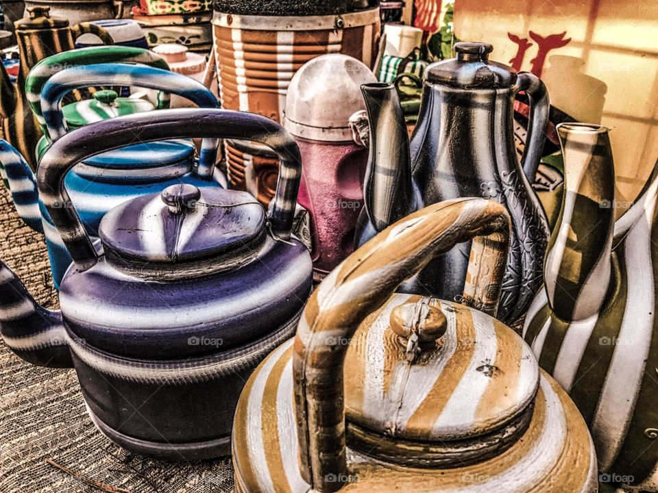 Festive colored pots on the side of the road. 