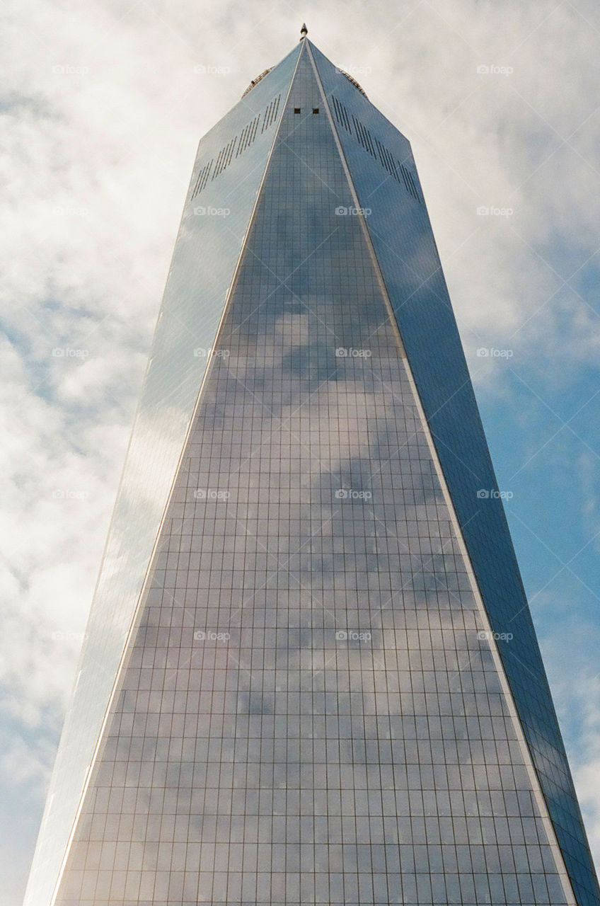 The New Hope Tower in New York City covering in cloudy and blue reflections 