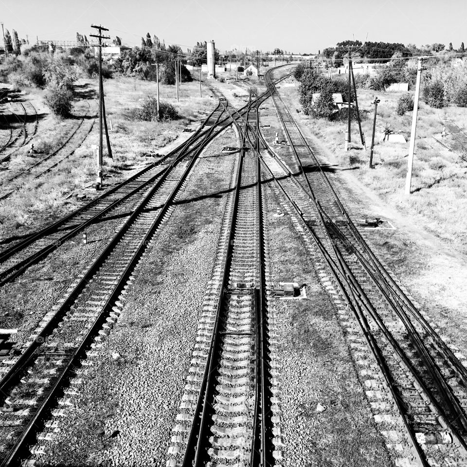 The railways. The perspective. Lines. Way. Rails. Black and white industrial landscape. 