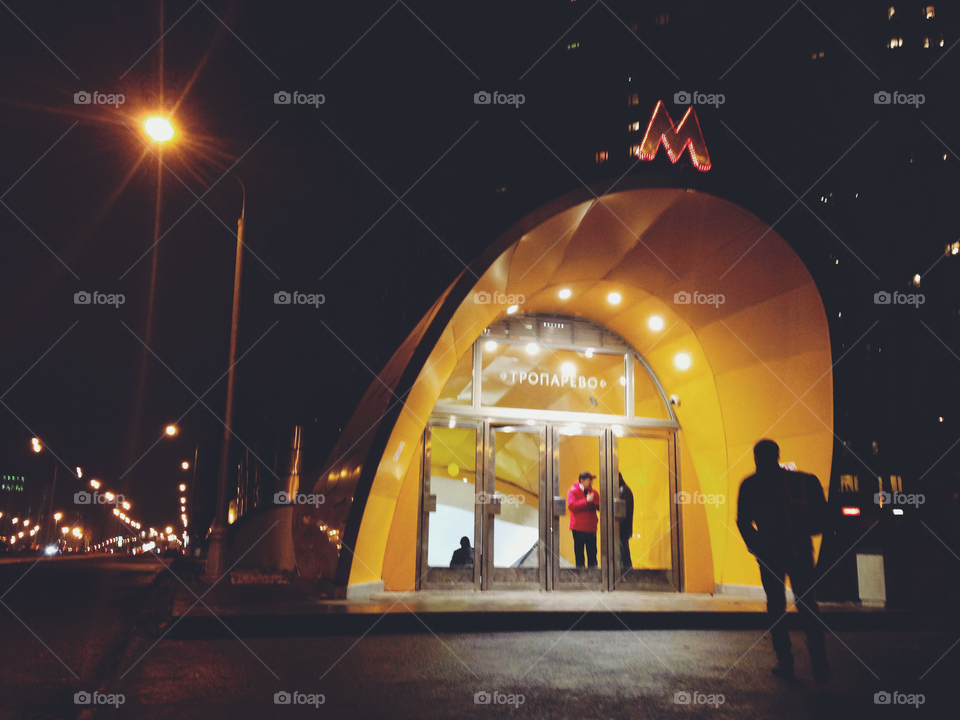 Brightly decorated entrance to one of the Moscow city metro underground stations at night