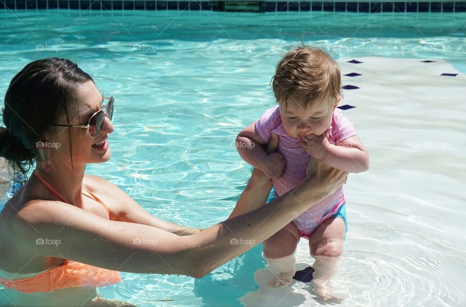Walking on Water. 4 months on this earth & water is her favorite thing.