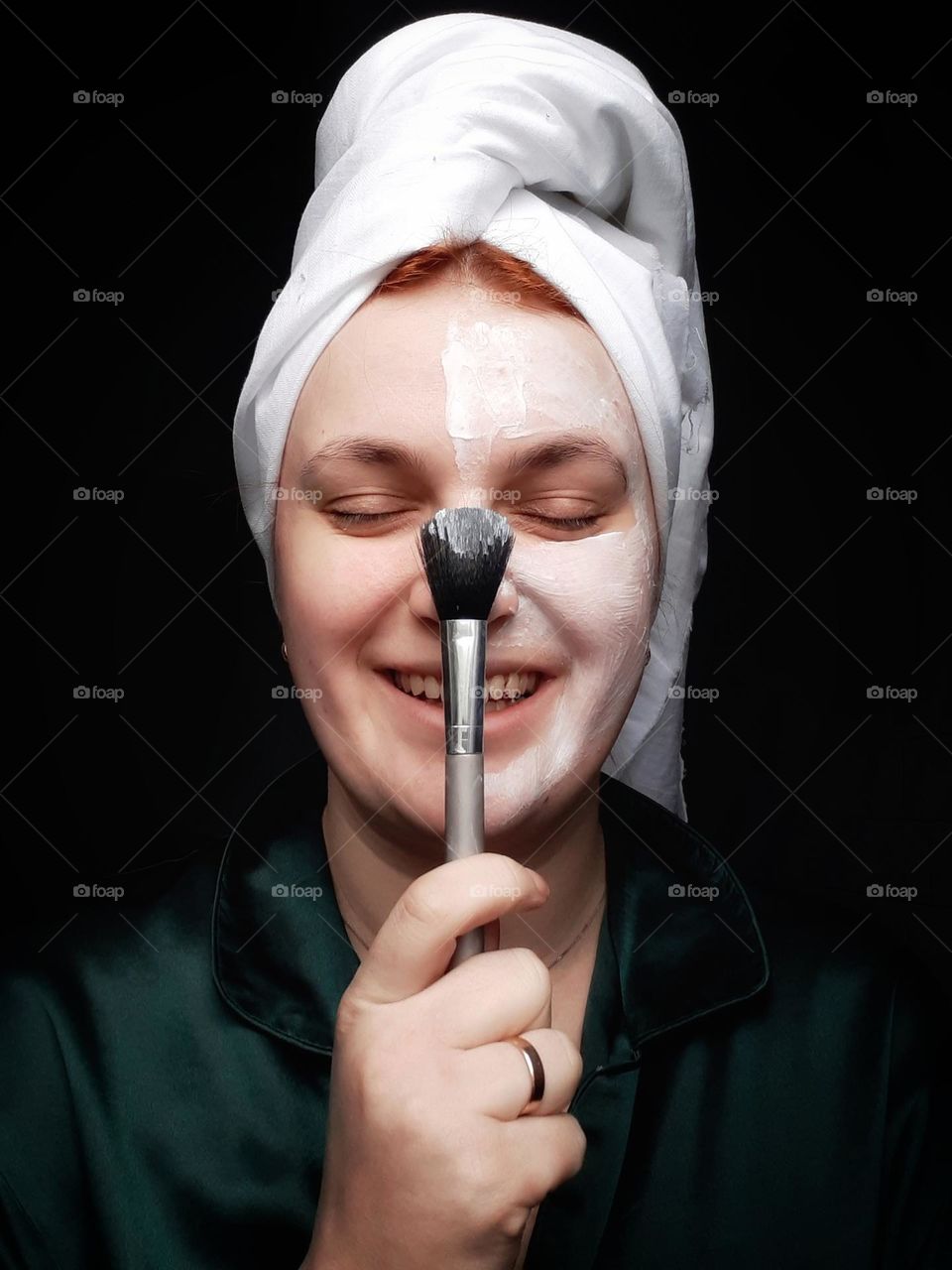 Applying the cream to the face