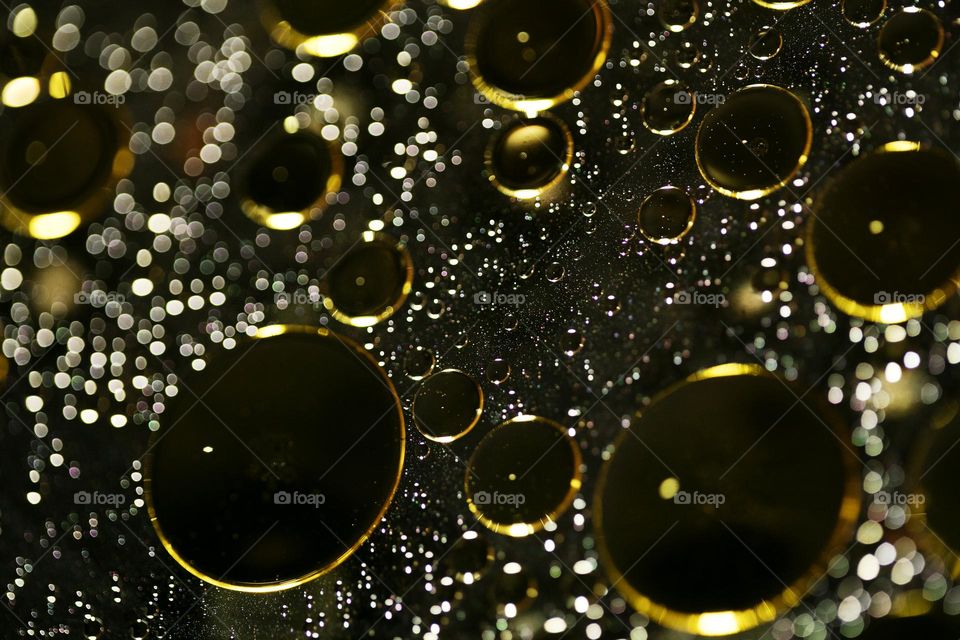 Golden oil Bubbles Close Up background amazing colours droplets of life in black texture macro look summer mood positive vibes wonderful day hustling daydreaming
