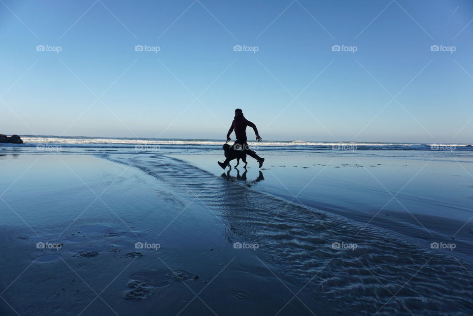Sunrise#beach#ocean#human#dog#moment