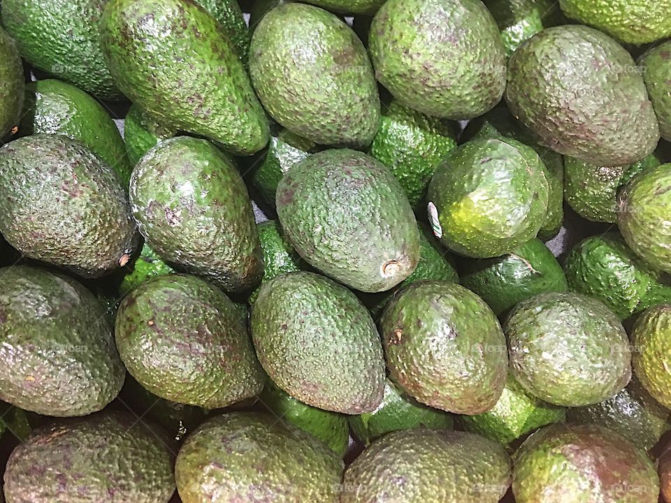Avocados up close in a supermarket. 