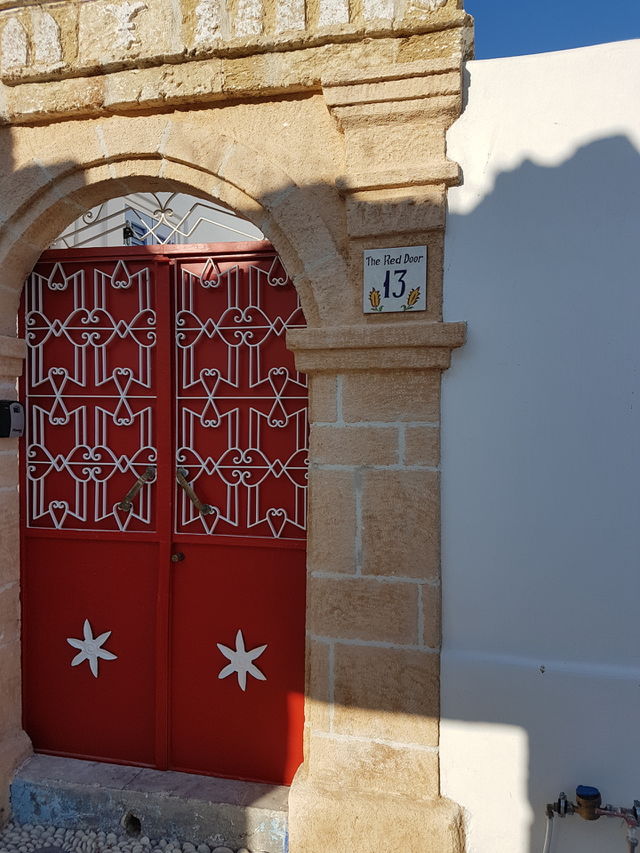 Red door in Koskinou