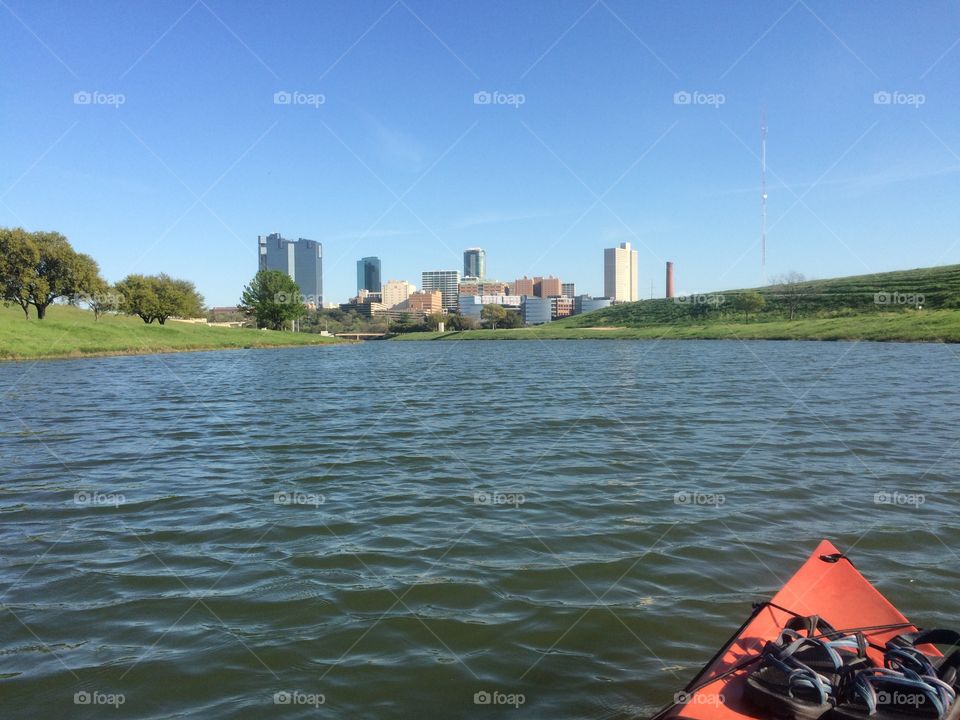 On the water. Kayaking in view of Fort Worth skyline 