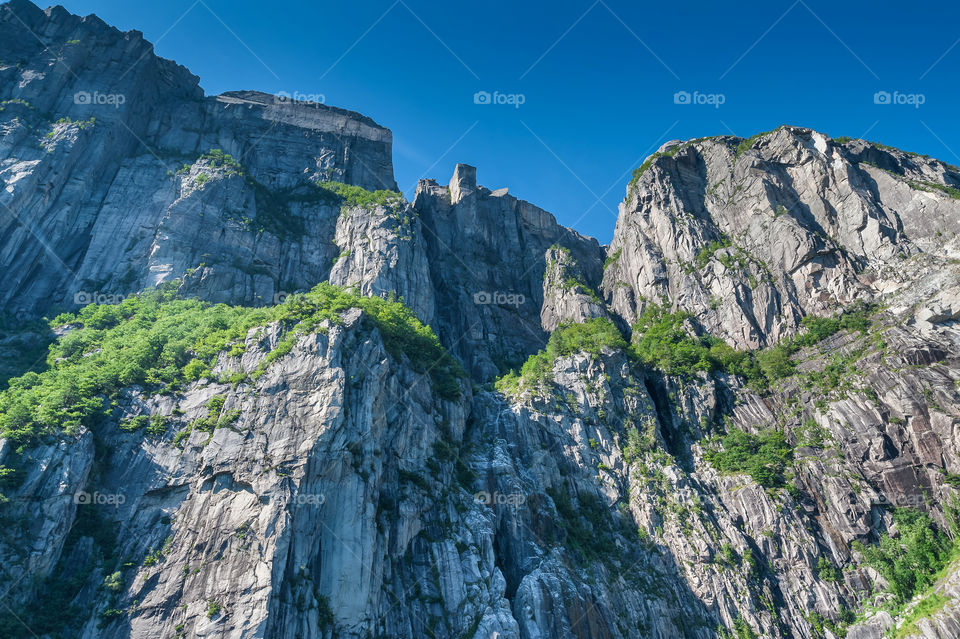 Preikestolen or Prekestolen or Pulpit Rock is a tourist attraction in Rogaland, Stavanger region in Norway. Preikestolen is a steep cliff which rises 604 metres above the Lysefjorden.