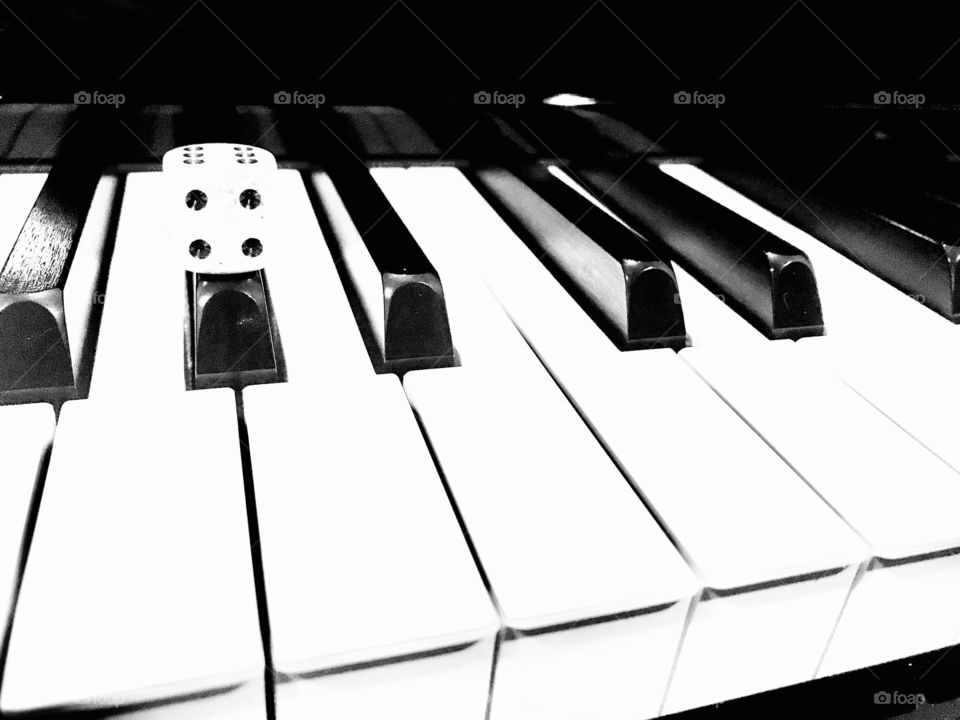 Black and white photo featuring two of my hobbies...playing my piano and playing with dice! 