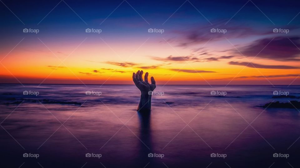 Sunrises and giant hand statue at Homigot beach, Pohang, South Korea 