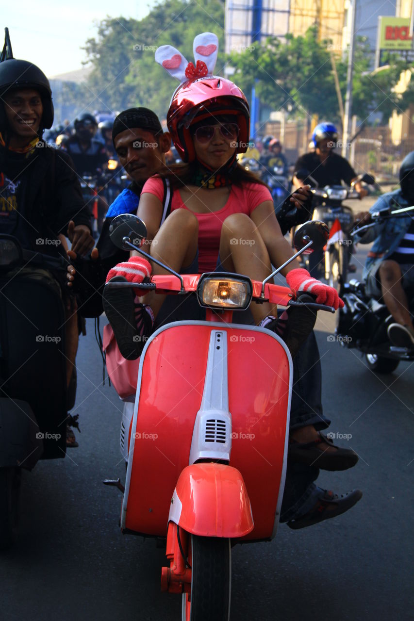 A Vespa fan girl in Makassar, South Sulawesi, Indonesia, joined the convoy on October 24, 2018, to celebrate Youth Oath Day