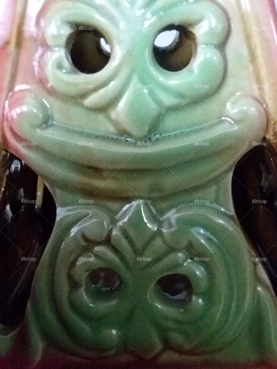 funny faces in a candle holder