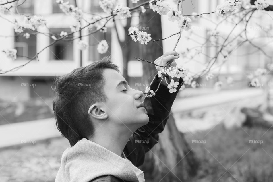 Portrait of teenage boy in black and white.