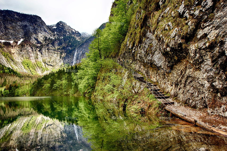 Reflection of trees and mountain in lake