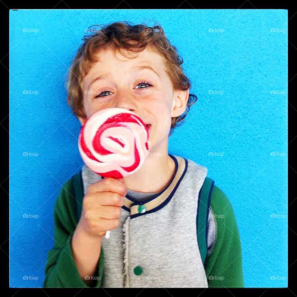 Cute boy with a lollypop
