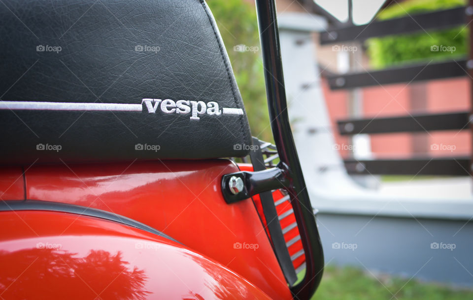 motorcycle vespa logo on the seat