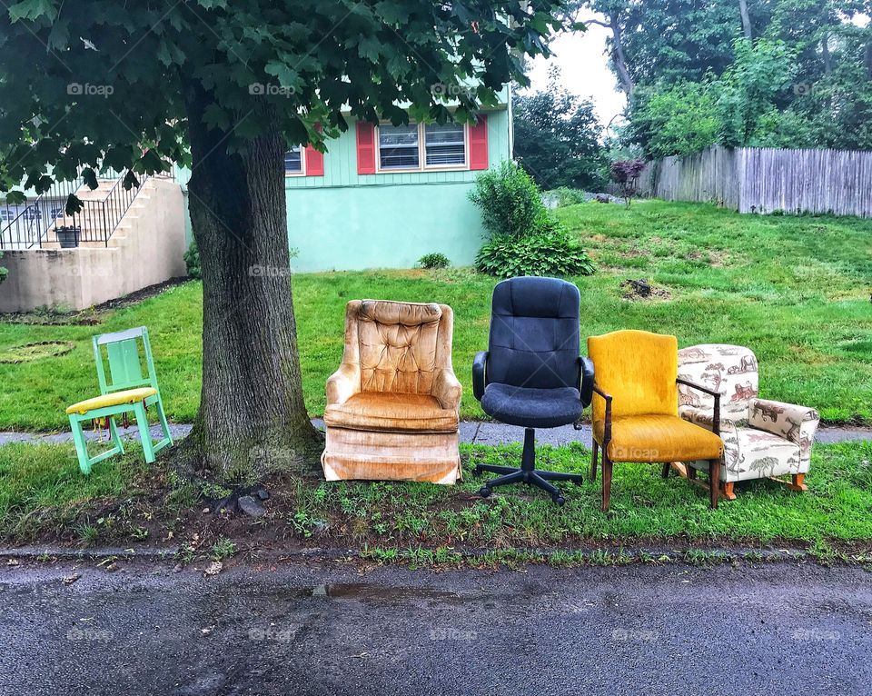 Black sheep.. old array of chairs on the side of the street