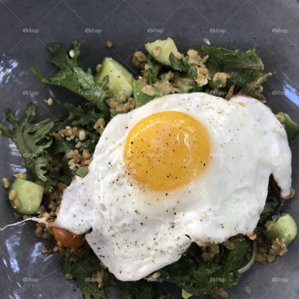 Fried egg on top of crispy rice bowl at Sqrl in Silverlake