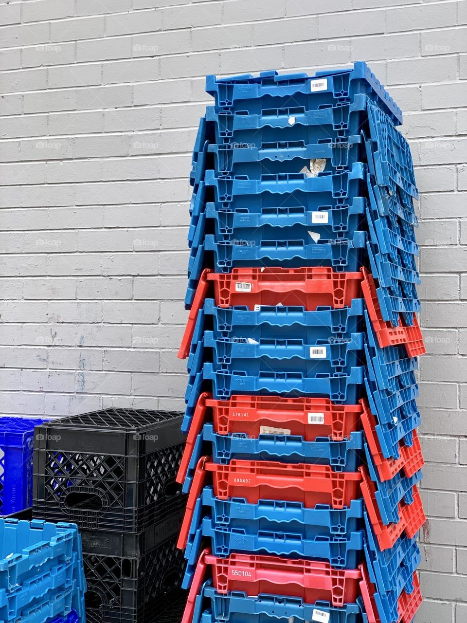 Blue and red piled up basket outside the grocery store.