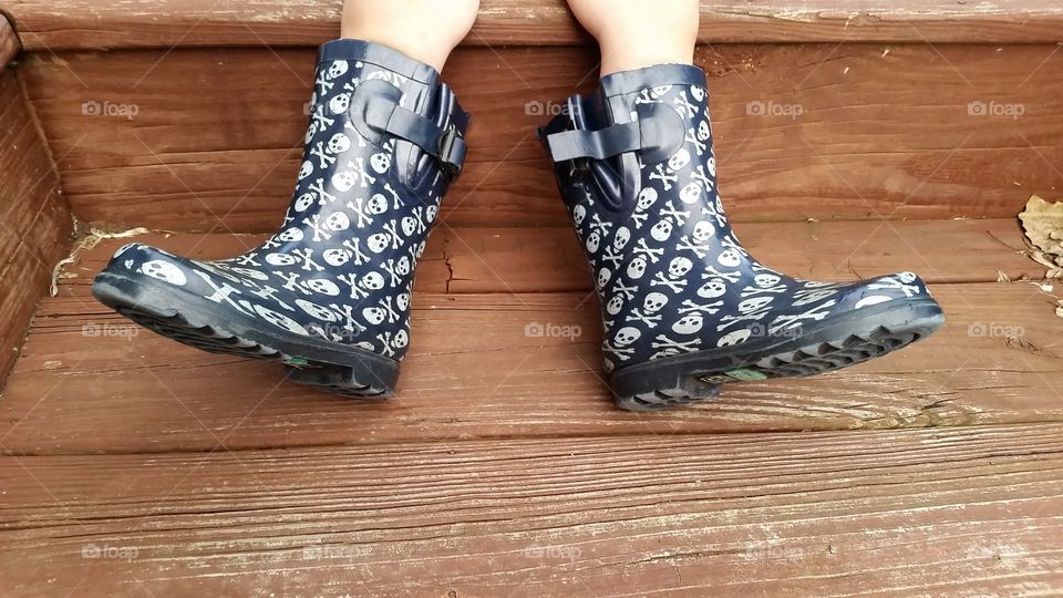 wrong feet. simple rain boots on the wrong feet