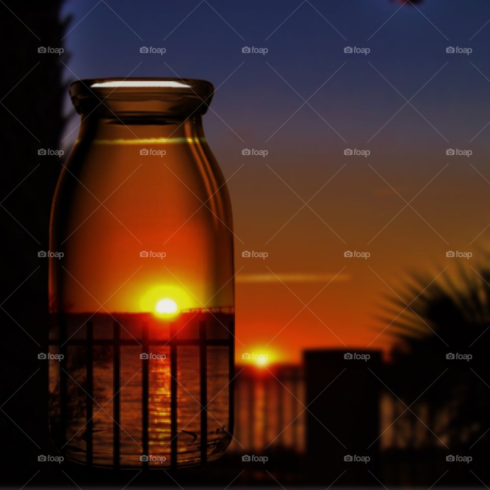 Sunset view in transparent bottle
