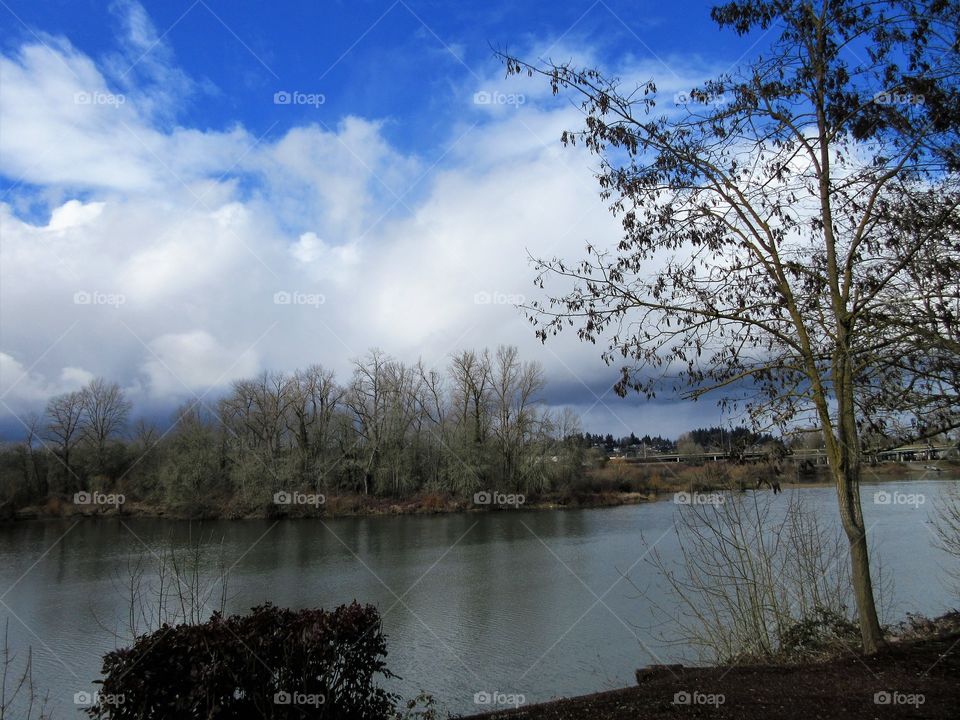 rain clouds over water