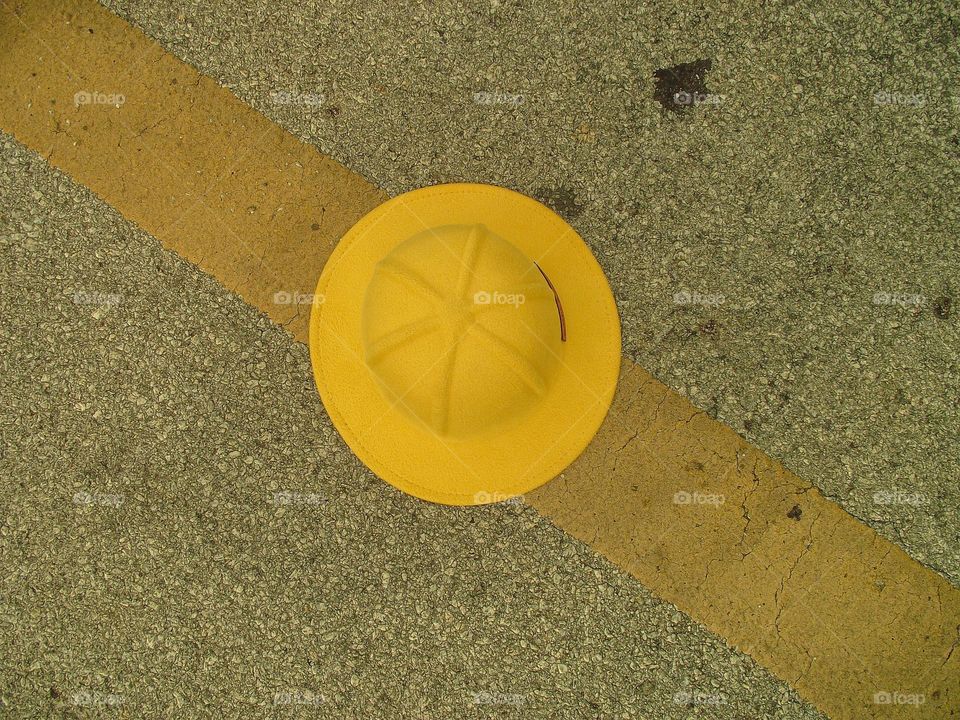 yellow head on a yellow line on the road