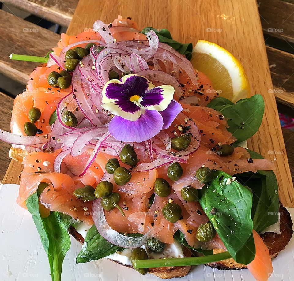 Smoked Salmon on sourdough with capers, onion, feta cheese. 