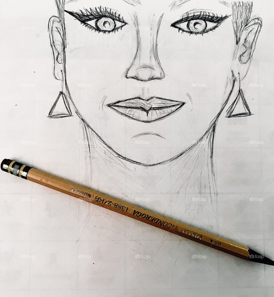 Unfinished pencil sketch of a portrait on scrap paper.