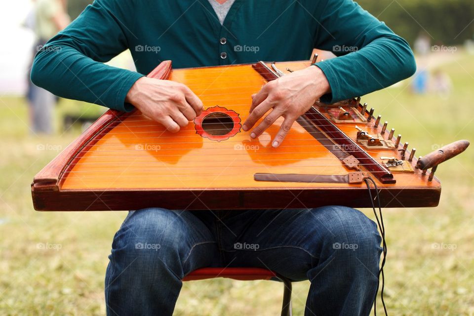 Close-up of man playing musical instrument