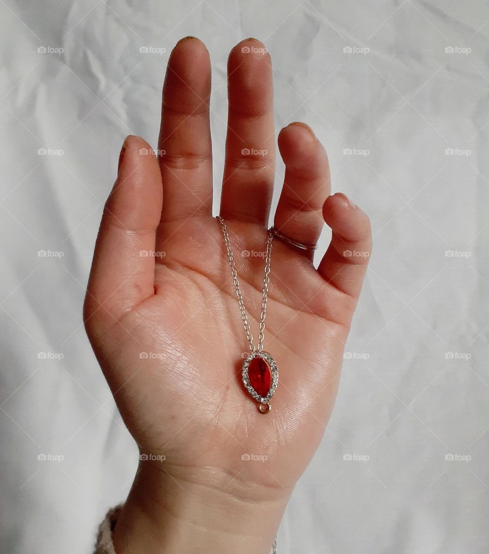 Silver pendant with a red ruby