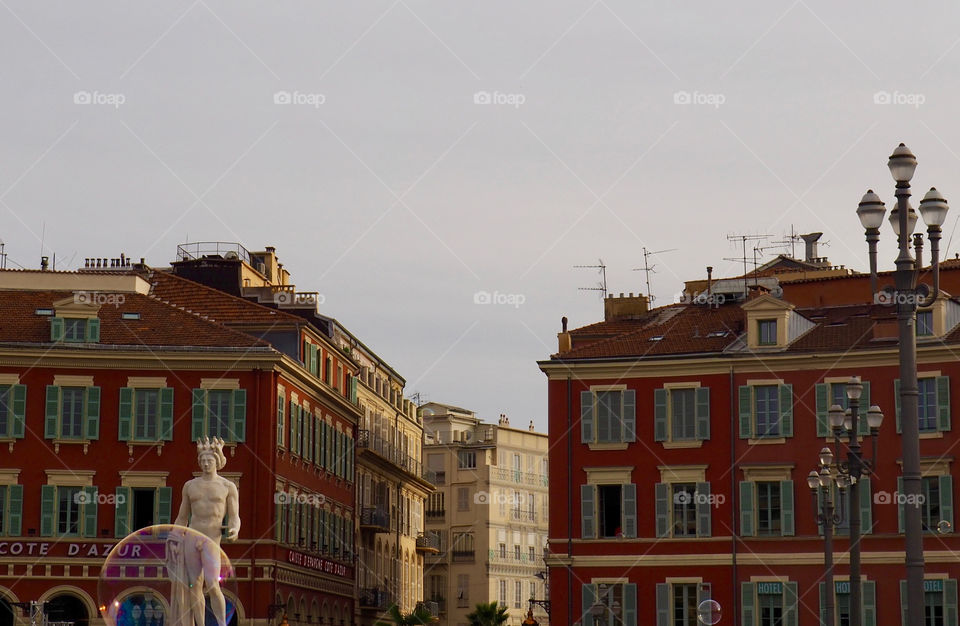 Bubbles in foreground of view of Place Massena in Nice, France.