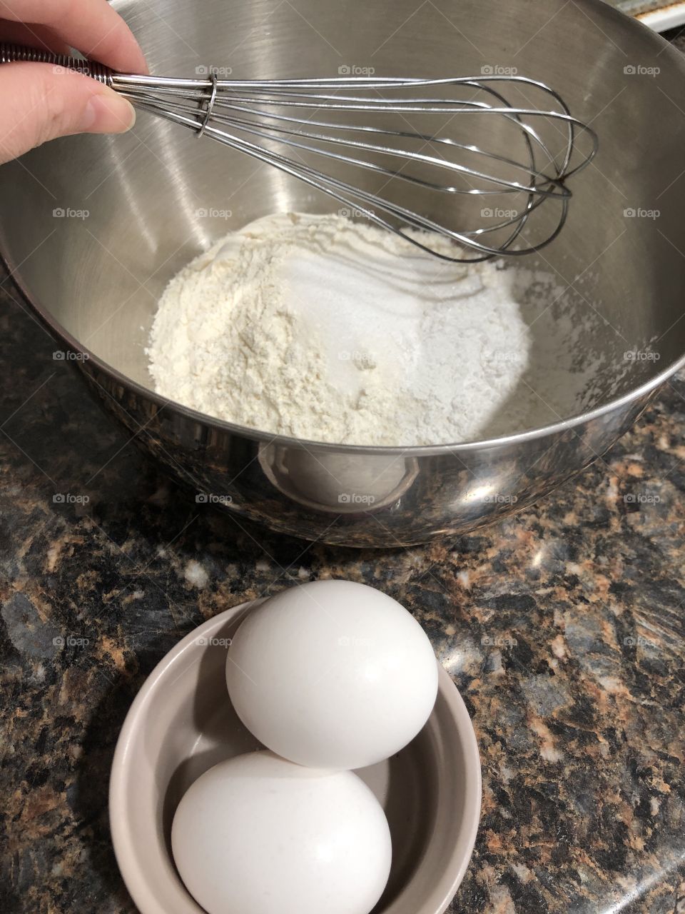 Whisk and flour in bowl