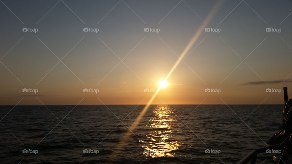 sun on the ocean at dusk