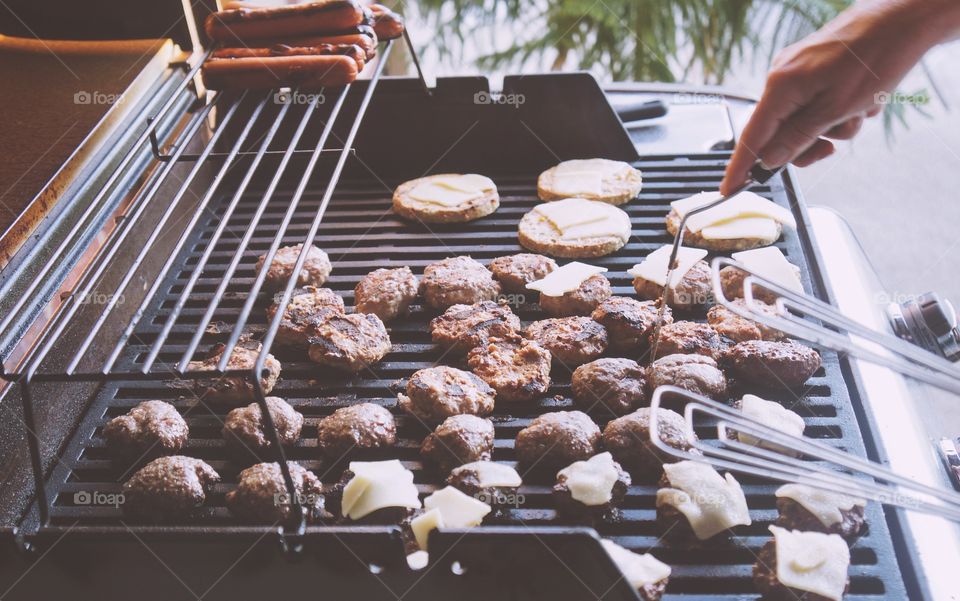 High angle view of meat on barbeque grill