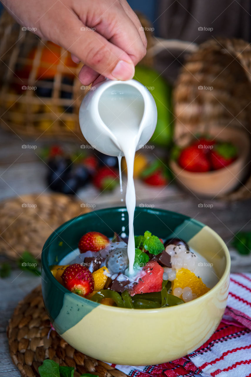 Fruit and milk in a bowl, so colorful, so fresh and tempting, a healthy snacks will bost your positive mood