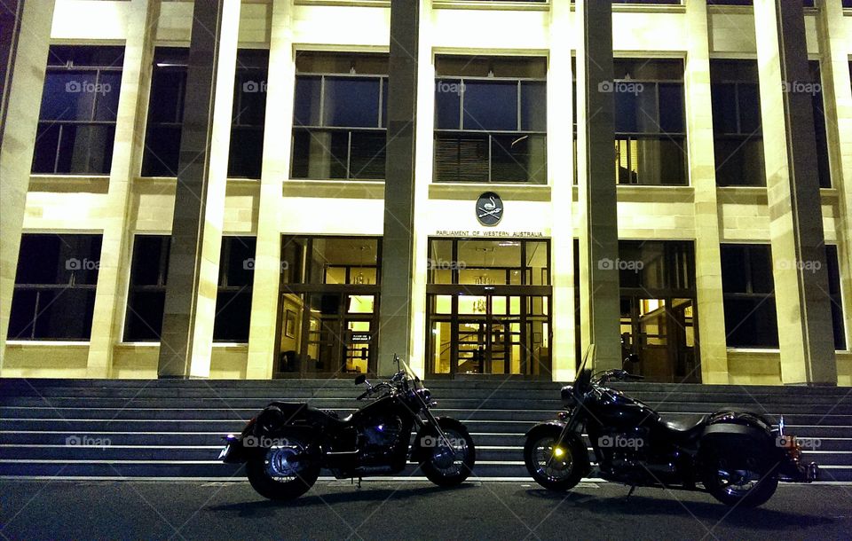 Bike's parked at the front of a Government Buiding