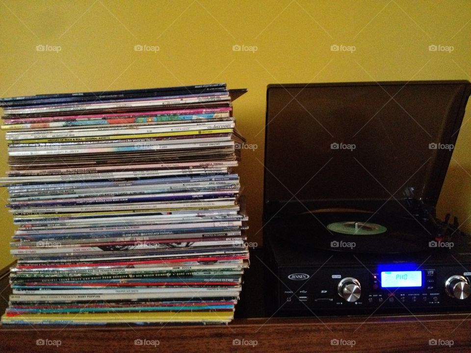 My old collection of vinyl records next to my turntable 