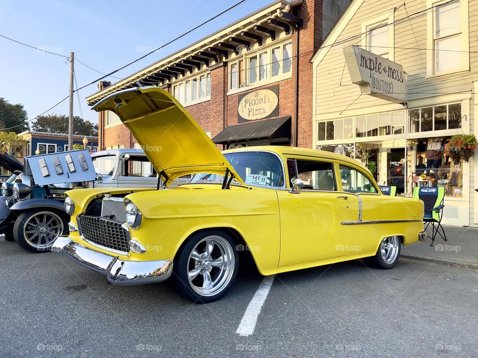 Yellow Chevrolet bel air with the open car hood