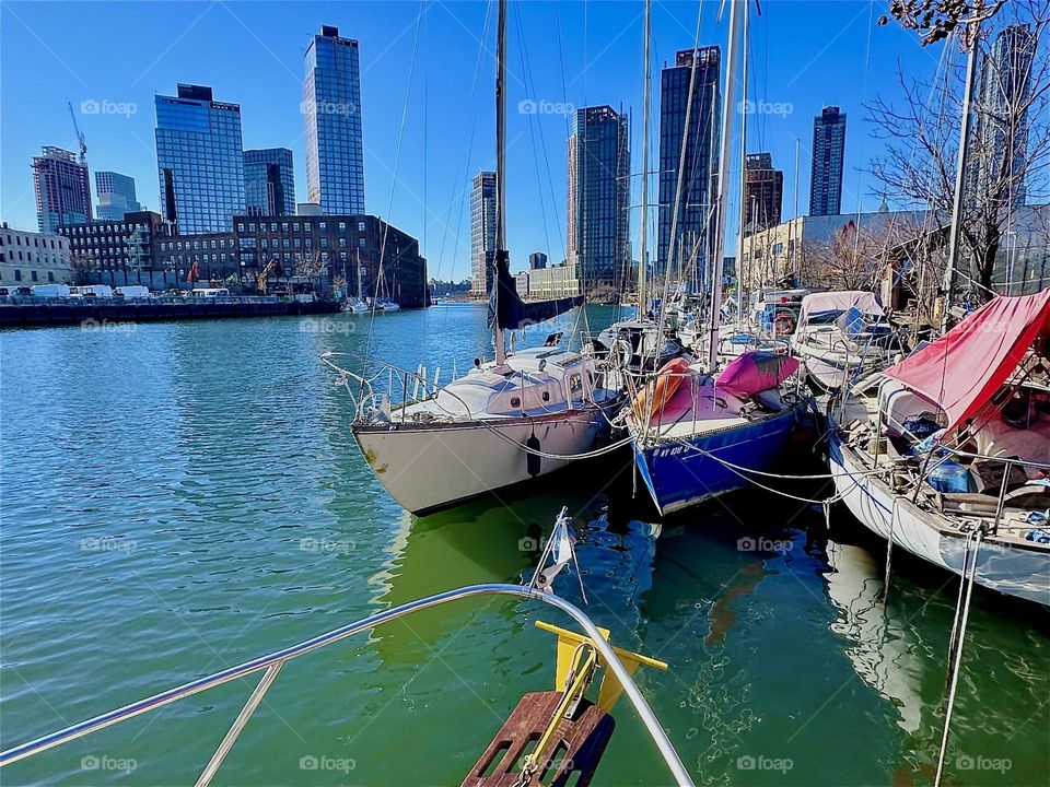 This is “Newtown Creek” by the “Pulaski Bridge” in LIC, Queens with its variety of boats seen from aboard “Salvation”, the “28 ft 1969 Luhrs” cabin cruiser that is home to myself and my longtime partner “Timothy Trespas”. 2024. Hypnotic Productions