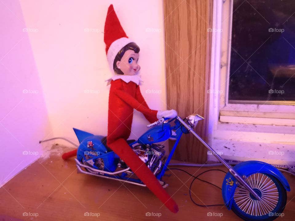 elf riding a motorcycle