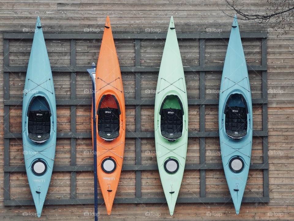 Kayaks on the outside wall of an L.L. Bean store.