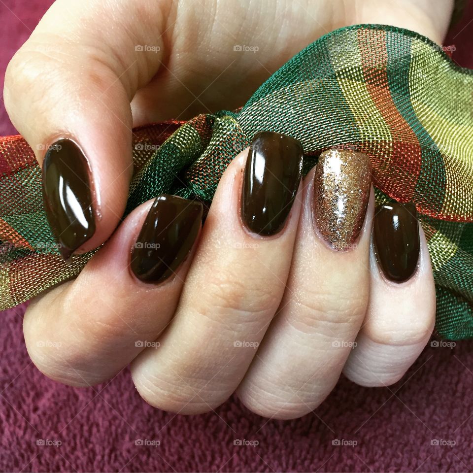 Raisin & bronze holiday polish on acrylic nails