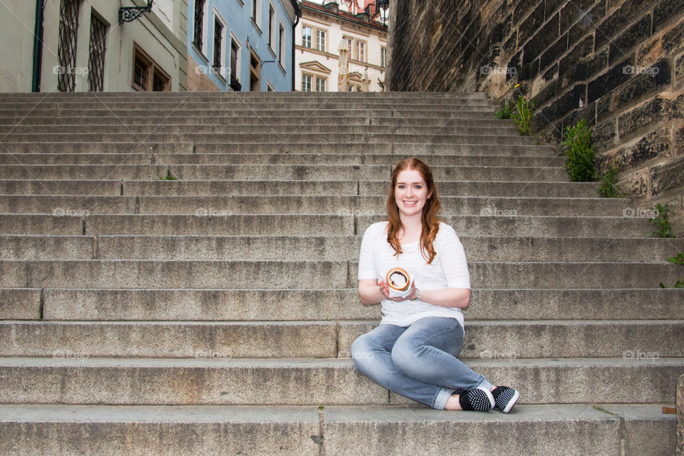 Young woman sitting in steps