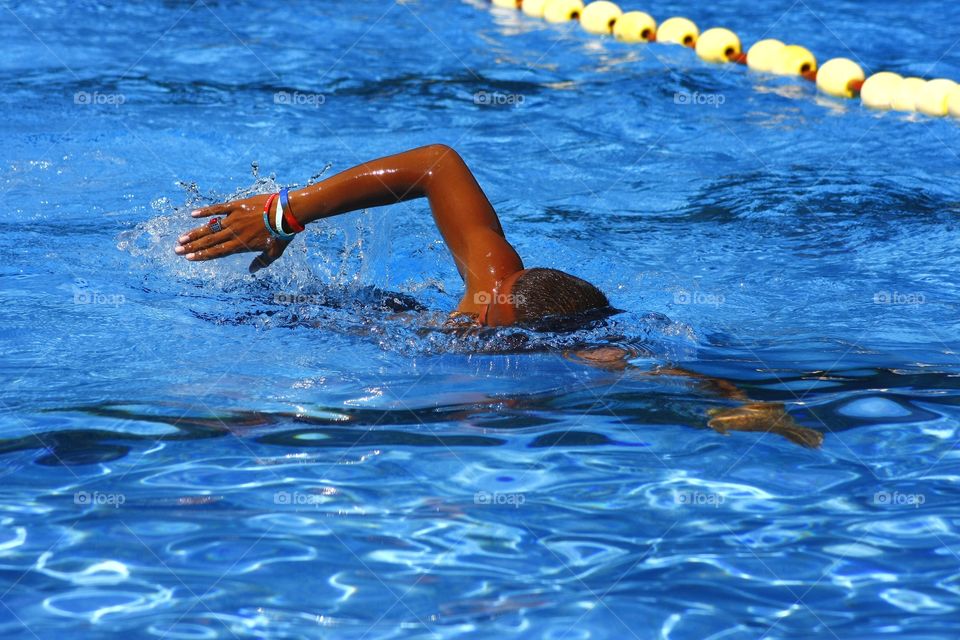 man swimming in a pool