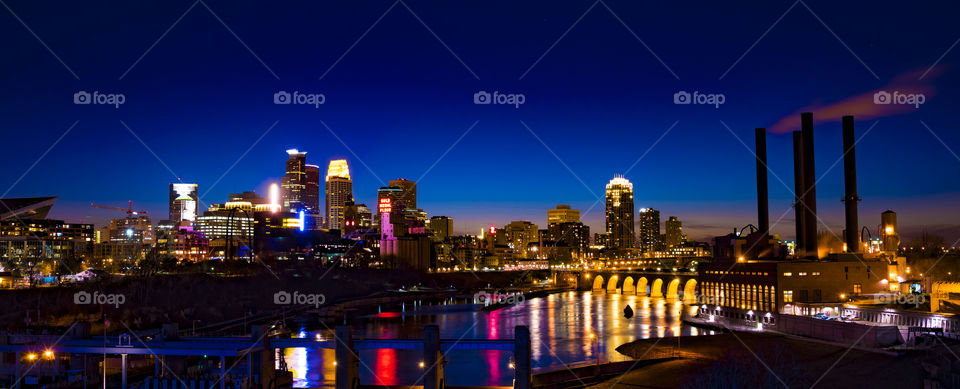 Minneapolis skyline and the Mississippi riverfront at dusk. Minneapolis, Minnesota.