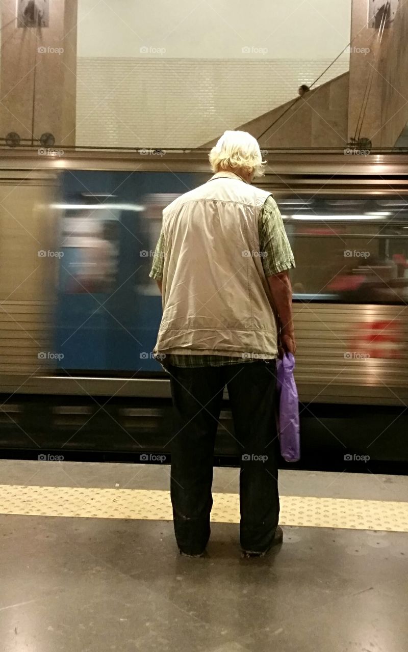 A man waiting for the subway train