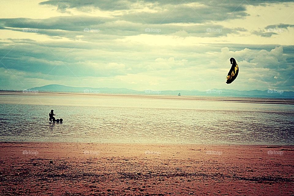 Flying a kite on the beach